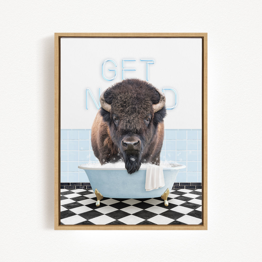 A buffalo is sitting in a bathtub filled with water, with the words "GET NICKED" written on the wall behind it.