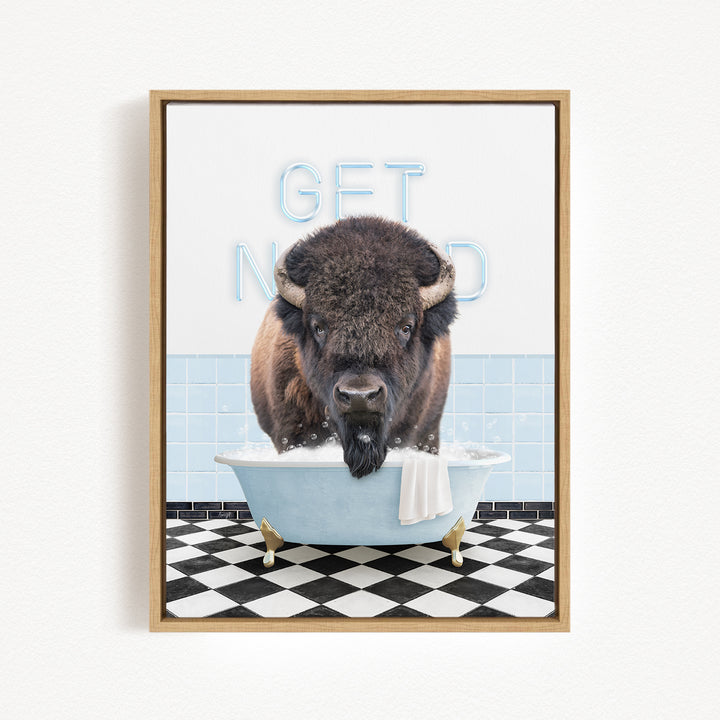 A buffalo is sitting in a bathtub filled with water, with the words "GET NICKED" written on the wall behind it.