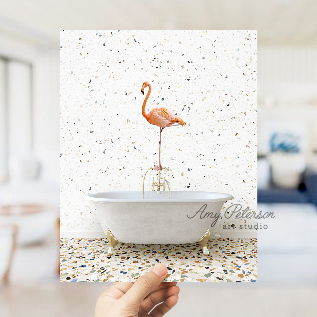 a person holding a card with a flamingo in a bathtub