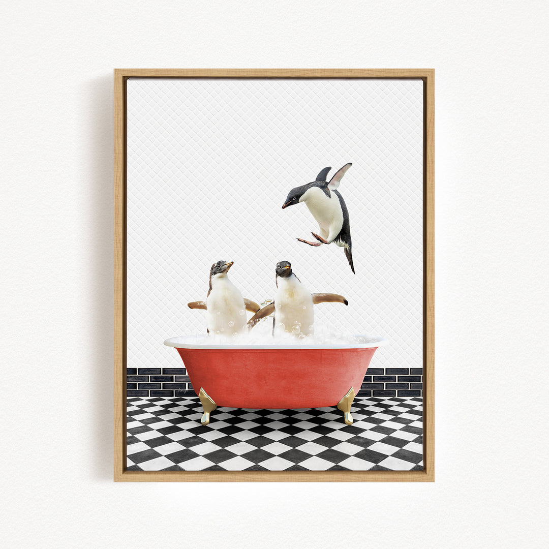 A framed image depicting two penguins sitting in a red bathtub, with one penguin flying out of the tub.