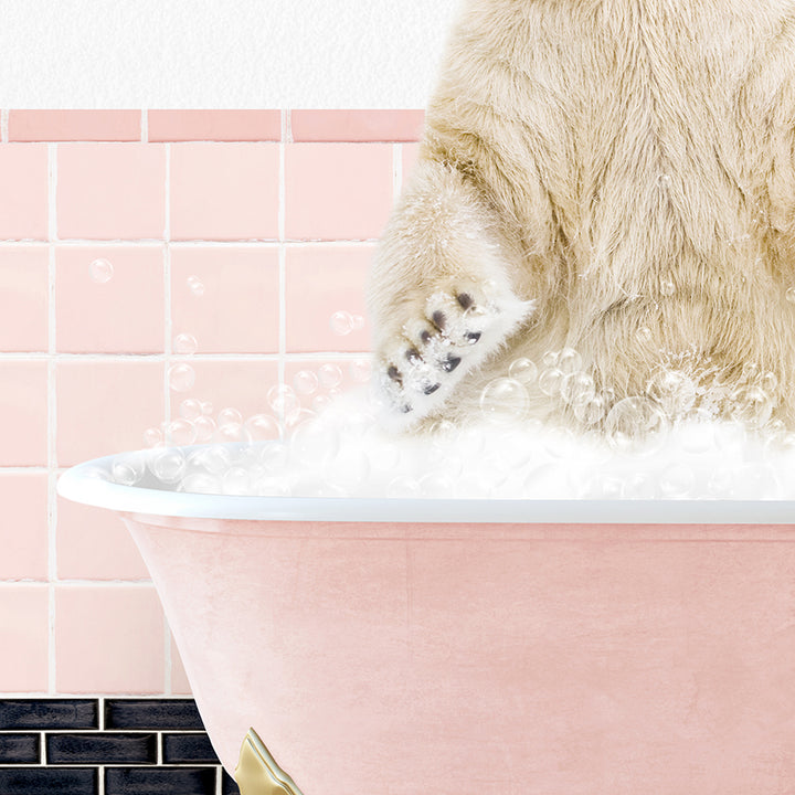 a polar bear sitting in a bathtub full of bubbles