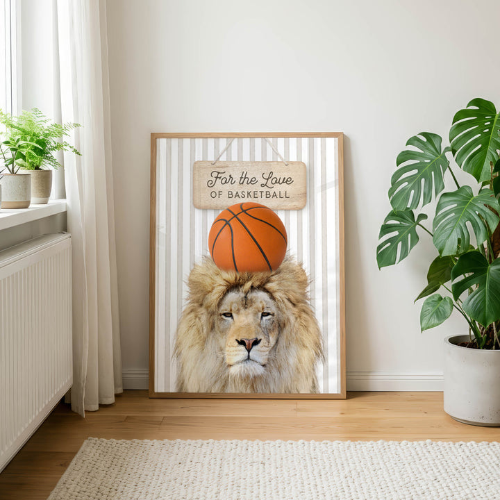 A framed poster featuring a lion's head with a basketball on its head, along with the text "For the Love of Basketball" is displayed on a wall in a room with a rug and potted plants.