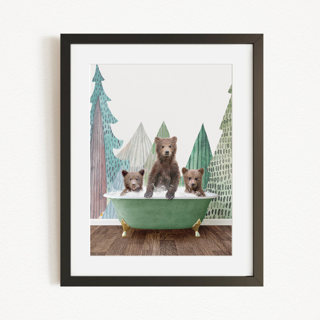 A framed image depicting three bears sitting in a green bathtub, with a forest scene in the background.