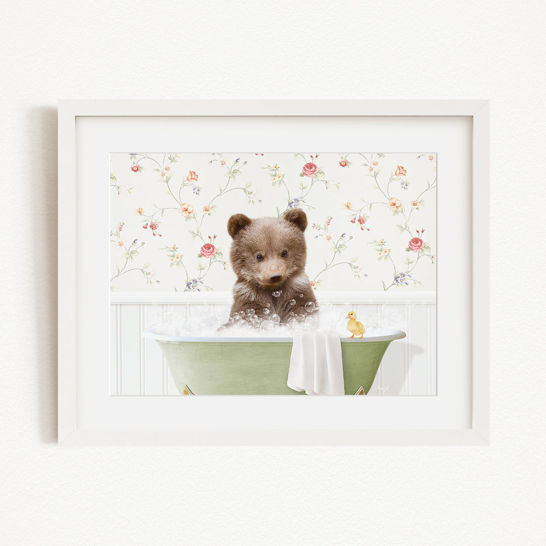 A cute brown bear sitting in a green bathtub filled with bubbles, surrounded by a floral wallpaper.