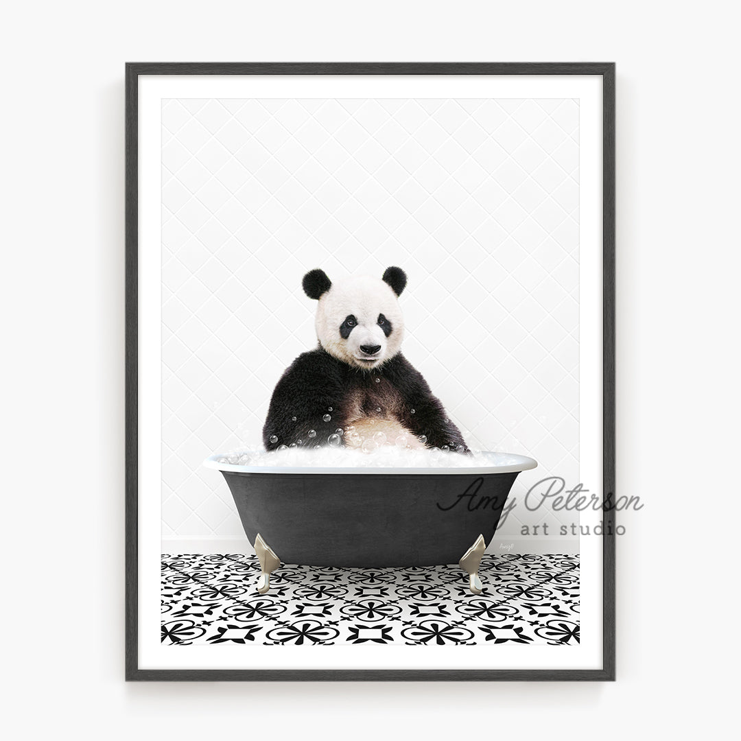 a panda bear sitting in a bath tub