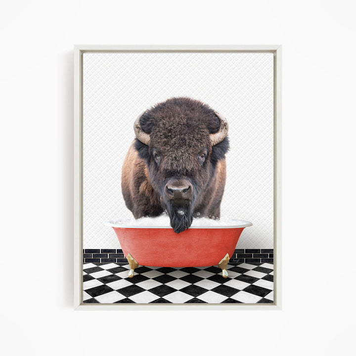A buffalo with large horns is standing in a red bathtub, with a black and white checkered floor in the background.