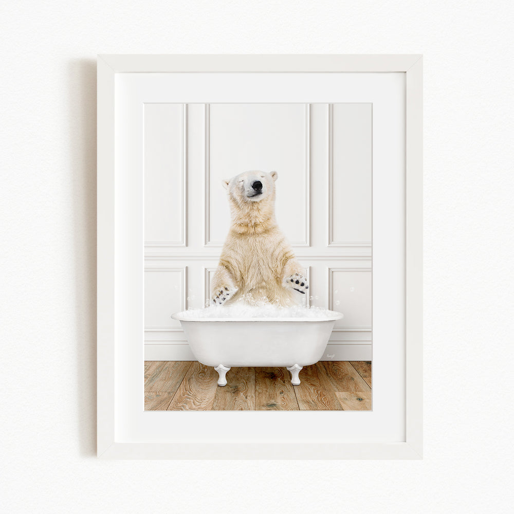 A polar bear sitting in a white bathtub filled with water, appearing to enjoy the bath.