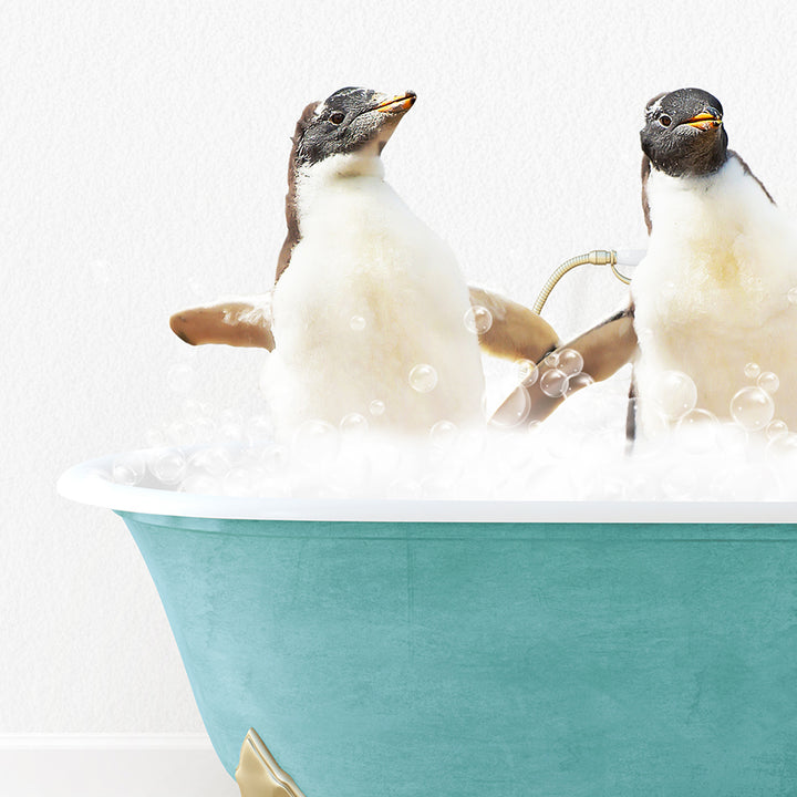 two penguins sitting in a bathtub with bubbles