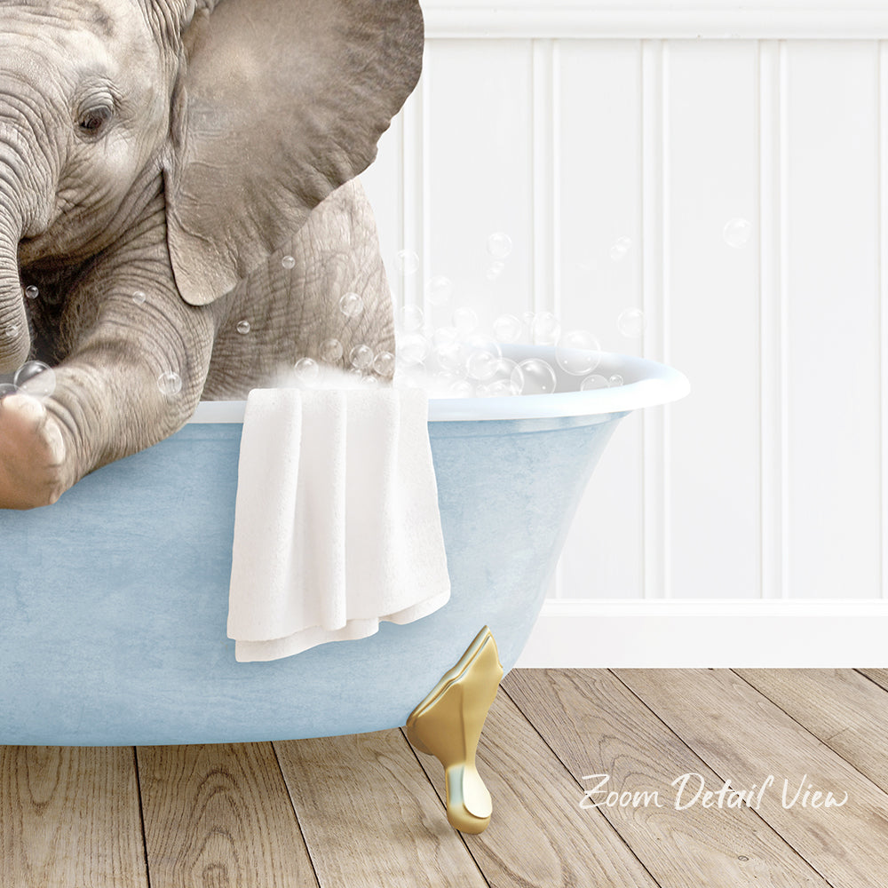 A baby elephant sitting in a blue bathtub, surrounded by bubbles, with a towel and gold shoe nearby.