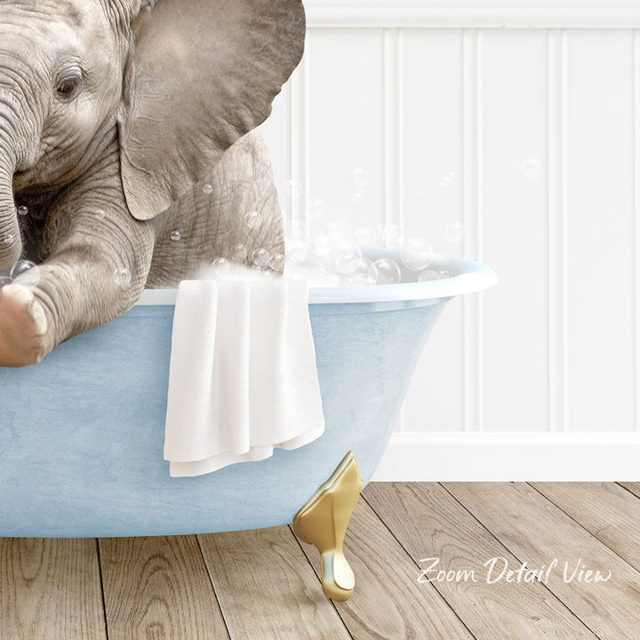 A baby elephant sitting in a blue bathtub, surrounded by bubbles, with a towel and gold shoe nearby.