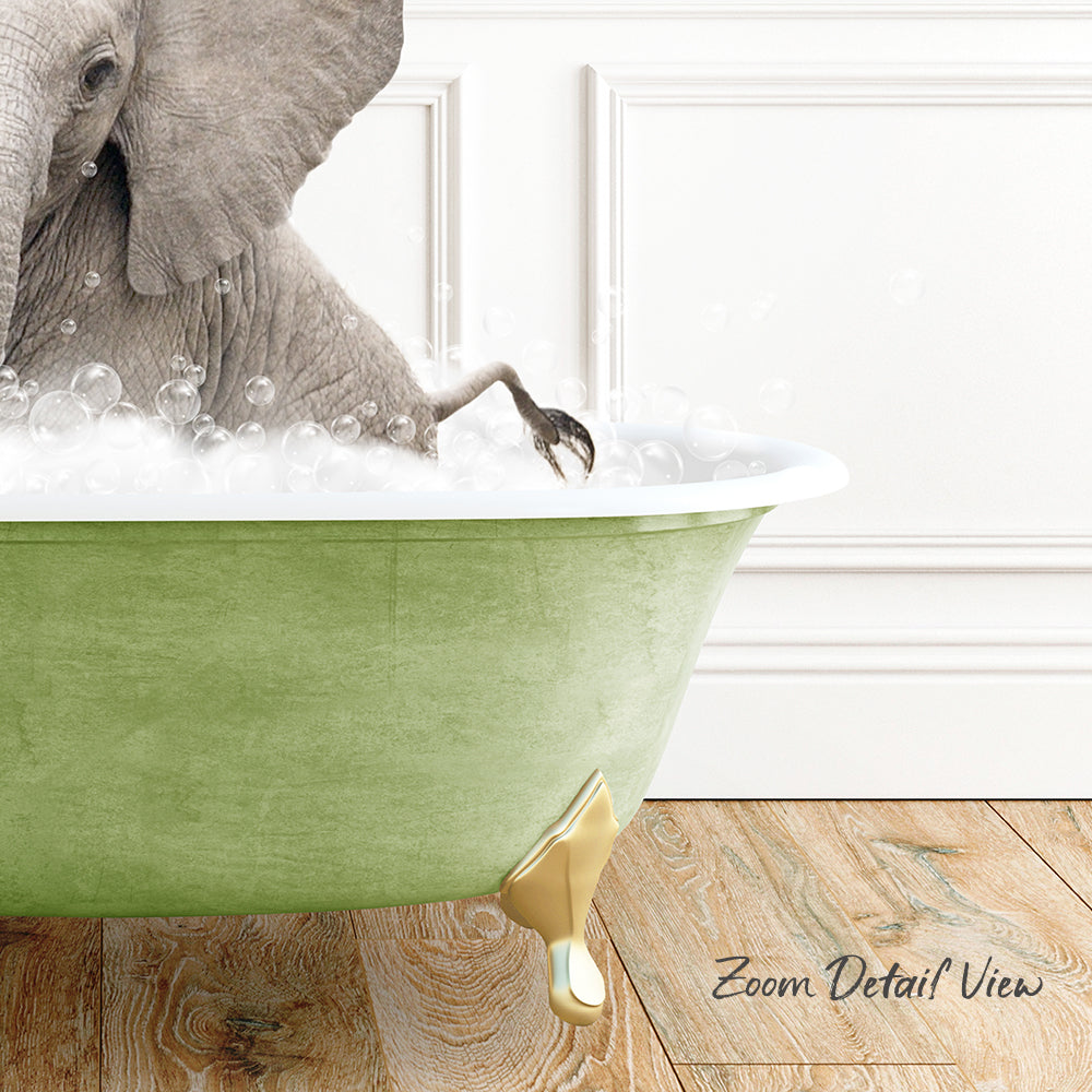A large elephant is sitting in a green bathtub filled with bubbles, with its trunk submerged in the water.