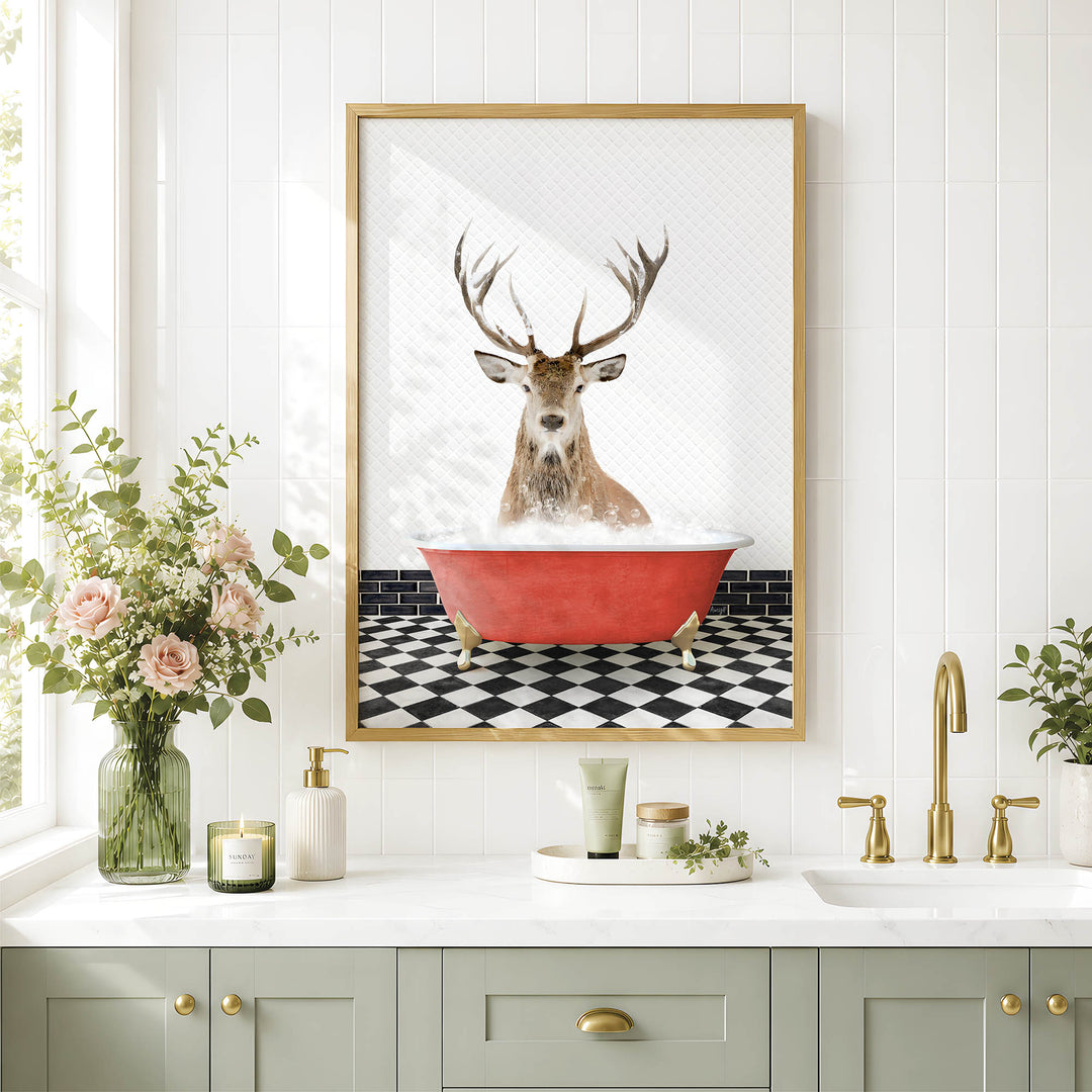 a bathroom with a framed picture of a deer sitting in a bathtub, surrounded by various bathroom accessories and decor.