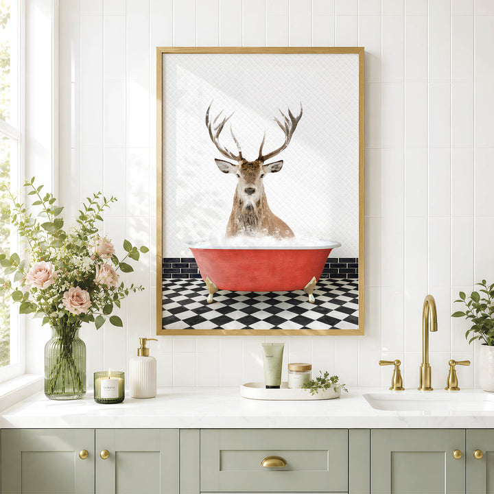a bathroom with a framed picture of a deer sitting in a bathtub, surrounded by various bathroom accessories and decor.
