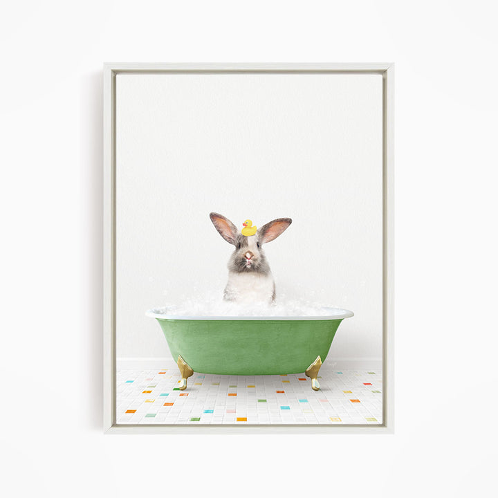 A rabbit sitting in a green bathtub filled with water, surrounded by colorful tiles on the floor.