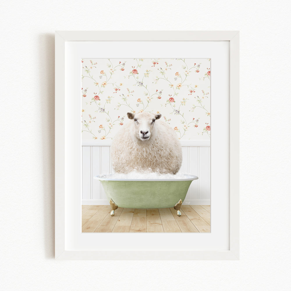 A fluffy white sheep sits in a green bathtub, surrounded by a floral wallpaper.
