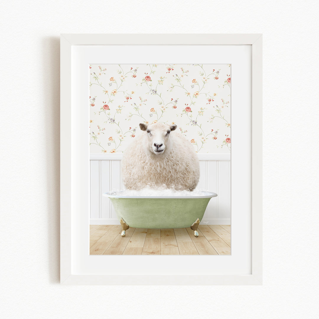 A fluffy white sheep sits in a green bathtub, surrounded by a floral wallpaper.