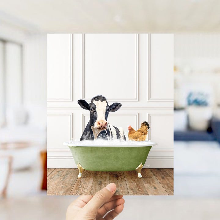 A cow and a chicken are sitting in a green bathtub, with the cow appearing to be enjoying a bath.
