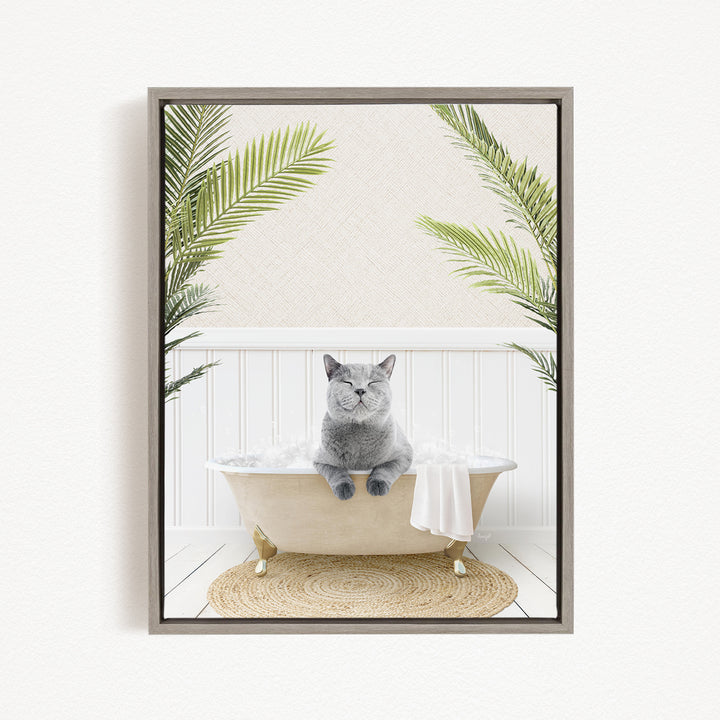A gray cat sitting in a bathtub filled with bubbles, surrounded by green plants.
