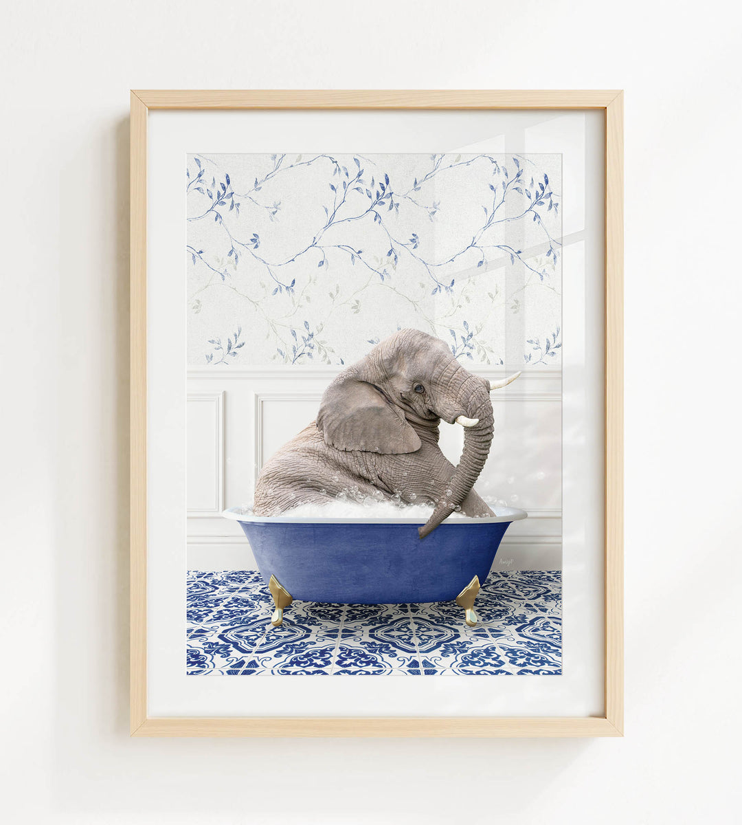 A gray elephant is sitting in a blue bathtub, surrounded by a blue and white patterned floor.