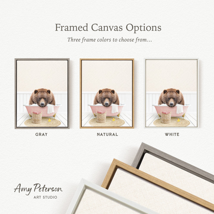 three framed canvas options, each featuring a brown bear sitting in a bathtub. The options include a gray frame, a natural frame, and a white frame.