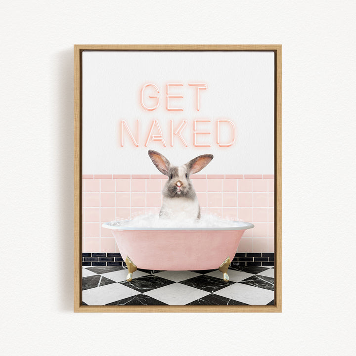 A framed image depicting a rabbit sitting in a pink bathtub filled with bubbles, with the text "GET NAKED" displayed above it.