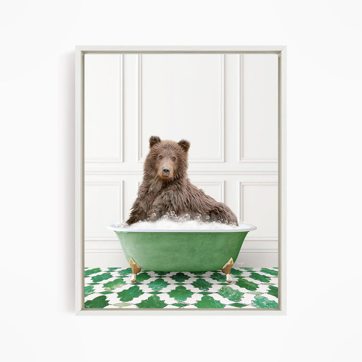 A brown bear sitting in a green bathtub filled with water, surrounded by a green and white patterned floor.