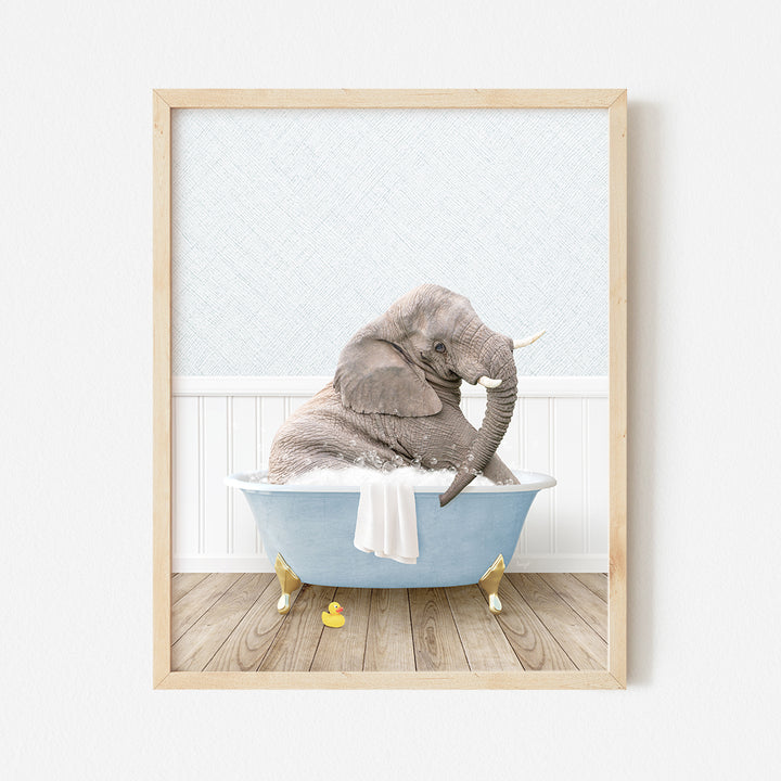 a picture of a baby elephant sitting in a bathtub