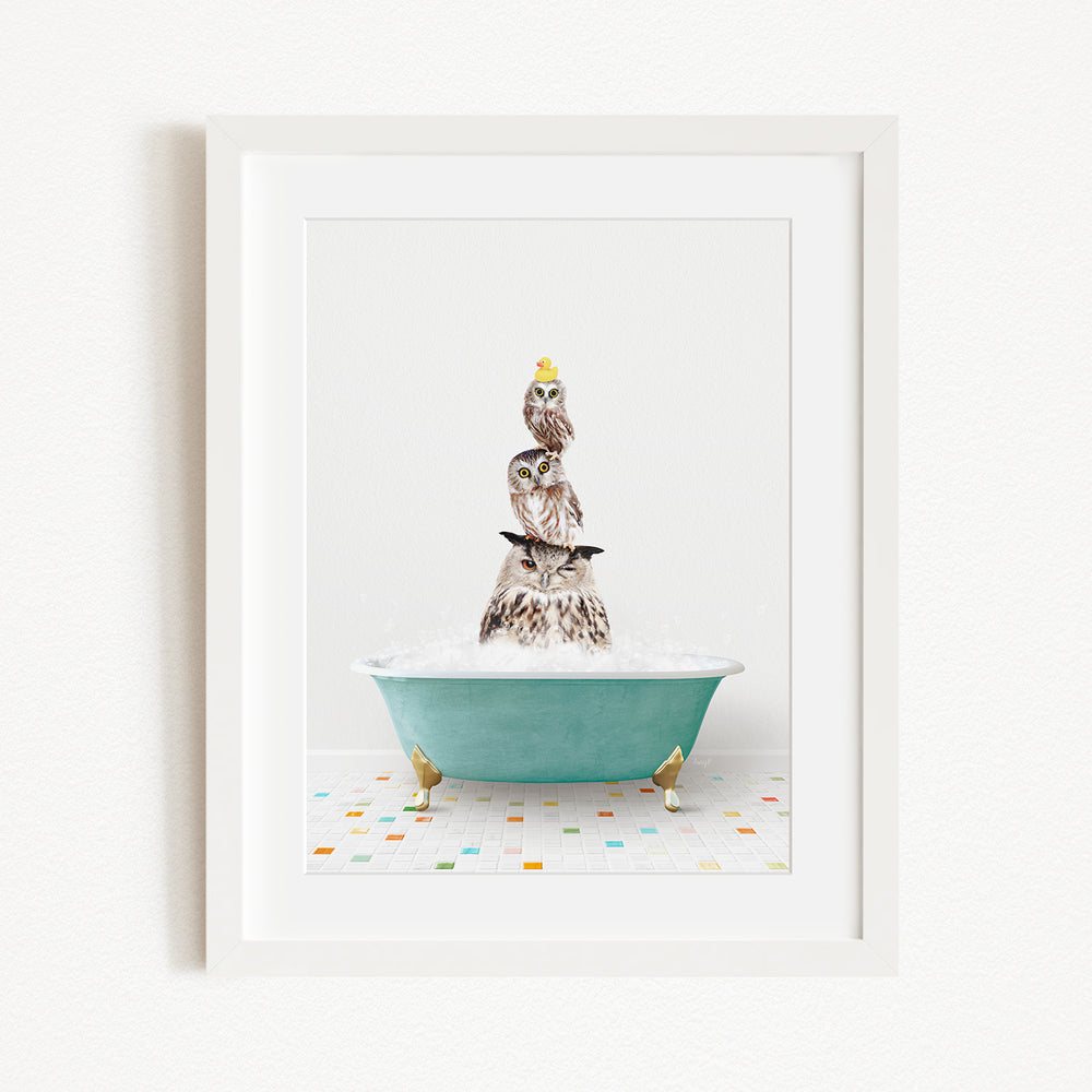 A framed image depicting a group of owls sitting in a bathtub filled with bubbles, creating a whimsical and playful scene.