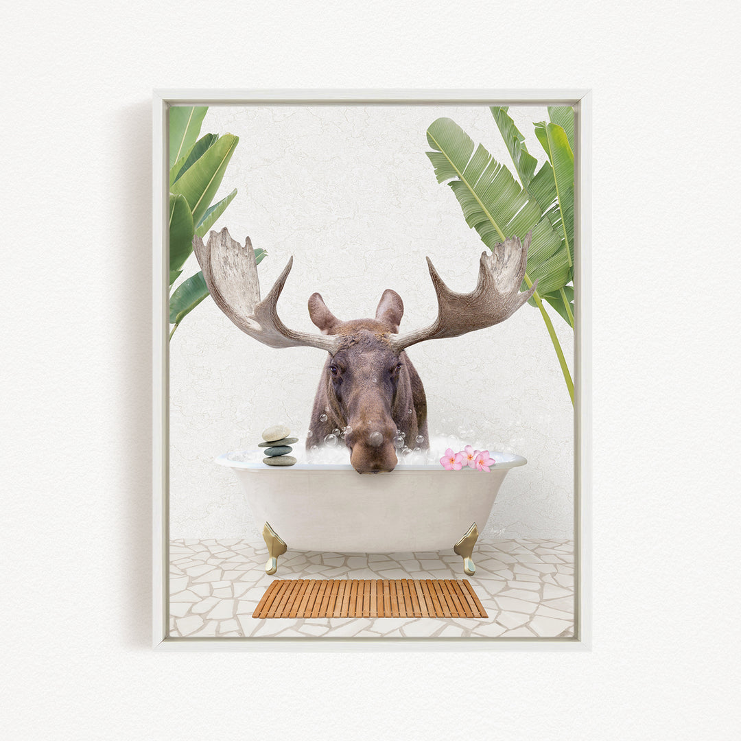 A moose with large antlers is sitting in a bathtub filled with water, surrounded by tropical plants and flowers.