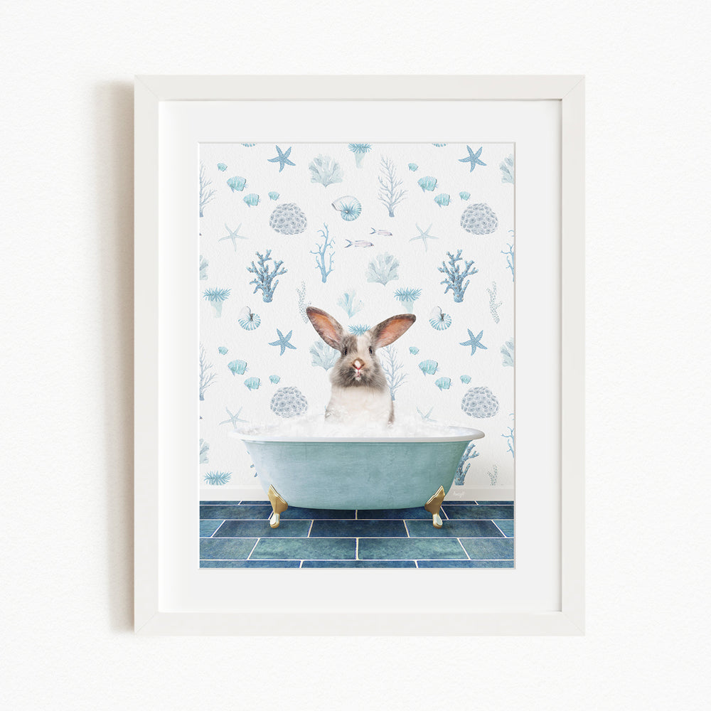 A white rabbit sitting in a blue bathtub filled with bubbles, surrounded by a pattern of seashells, starfish, and other marine life.