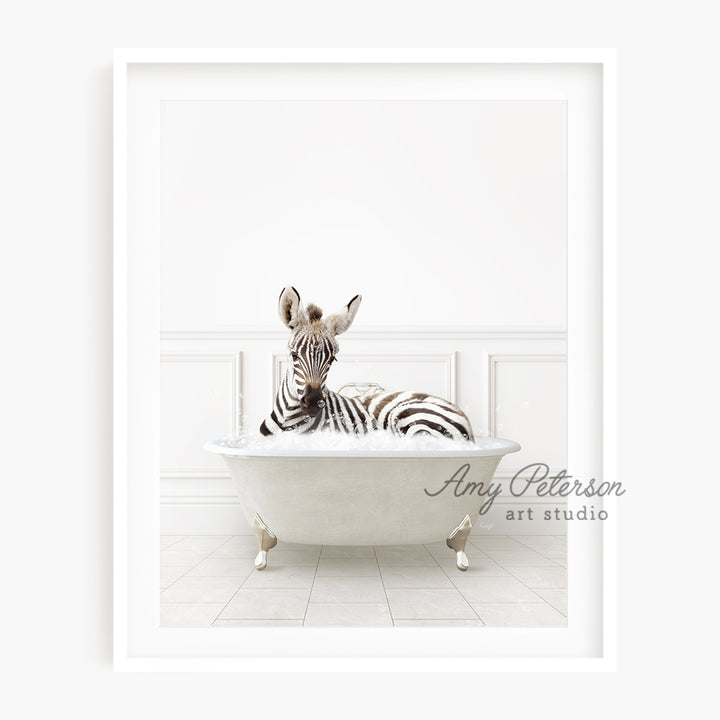 a zebra laying in a bathtub with a white wall behind it