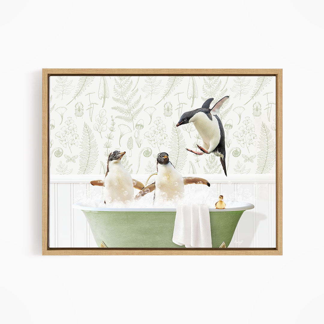 A framed image depicting three penguins sitting in a green bathtub, with one penguin flying towards the tub.