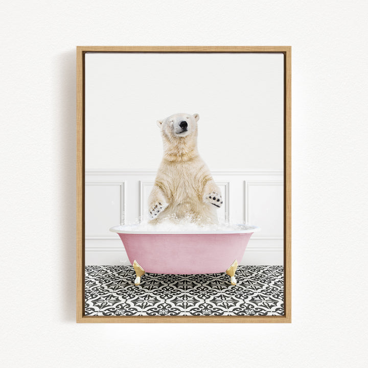 A polar bear standing in a pink bathtub filled with water, with its paws raised in the air.