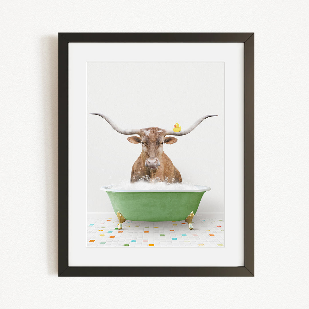 A brown cow with large horns is sitting in a green bathtub, surrounded by colorful tiles on the floor.