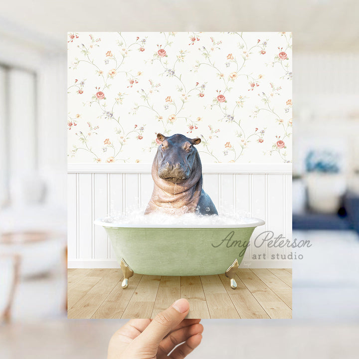 a hippo sitting in a bathtub with a flowered wallpaper behind it