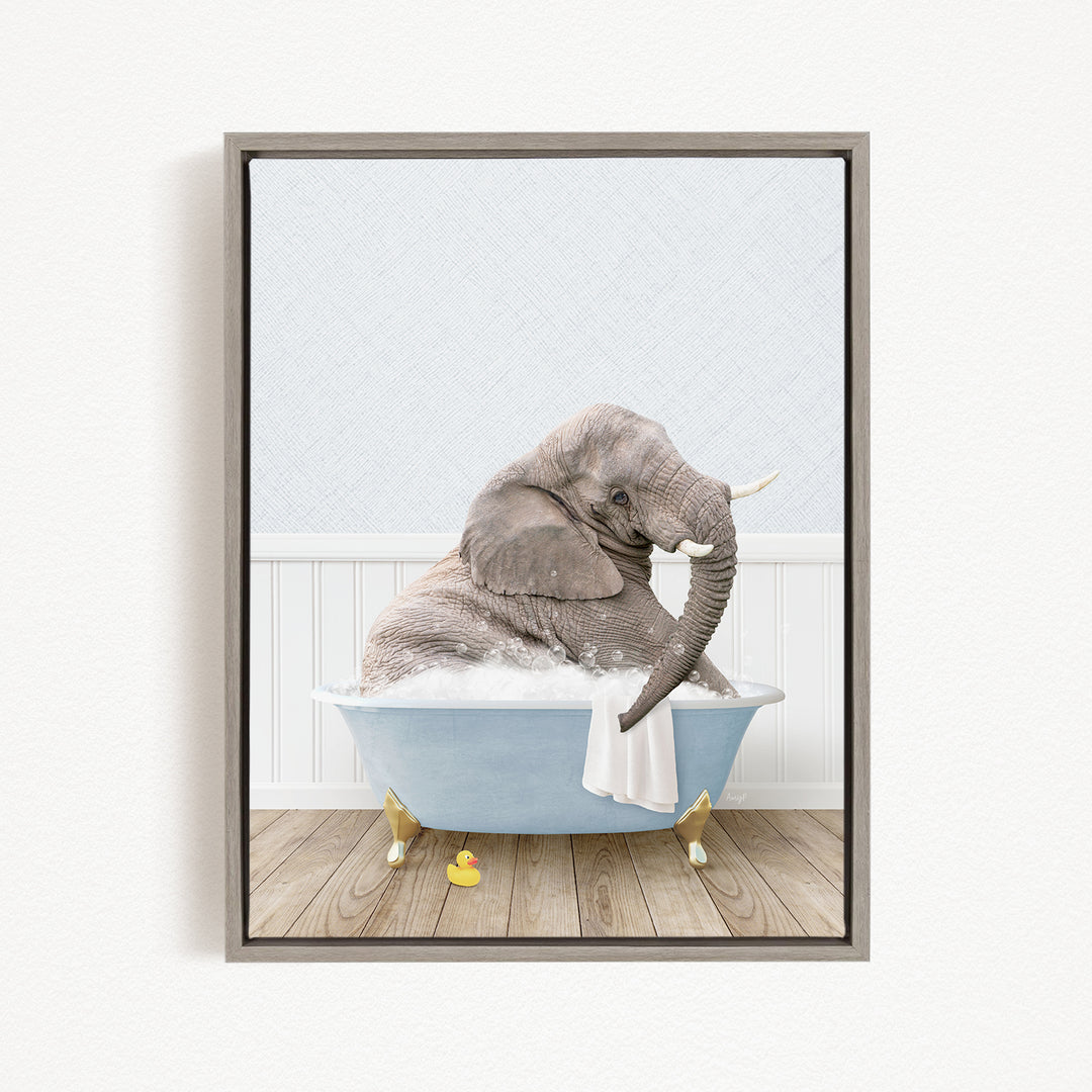 A gray elephant sitting in a blue bathtub filled with water, surrounded by yellow rubber duckies.