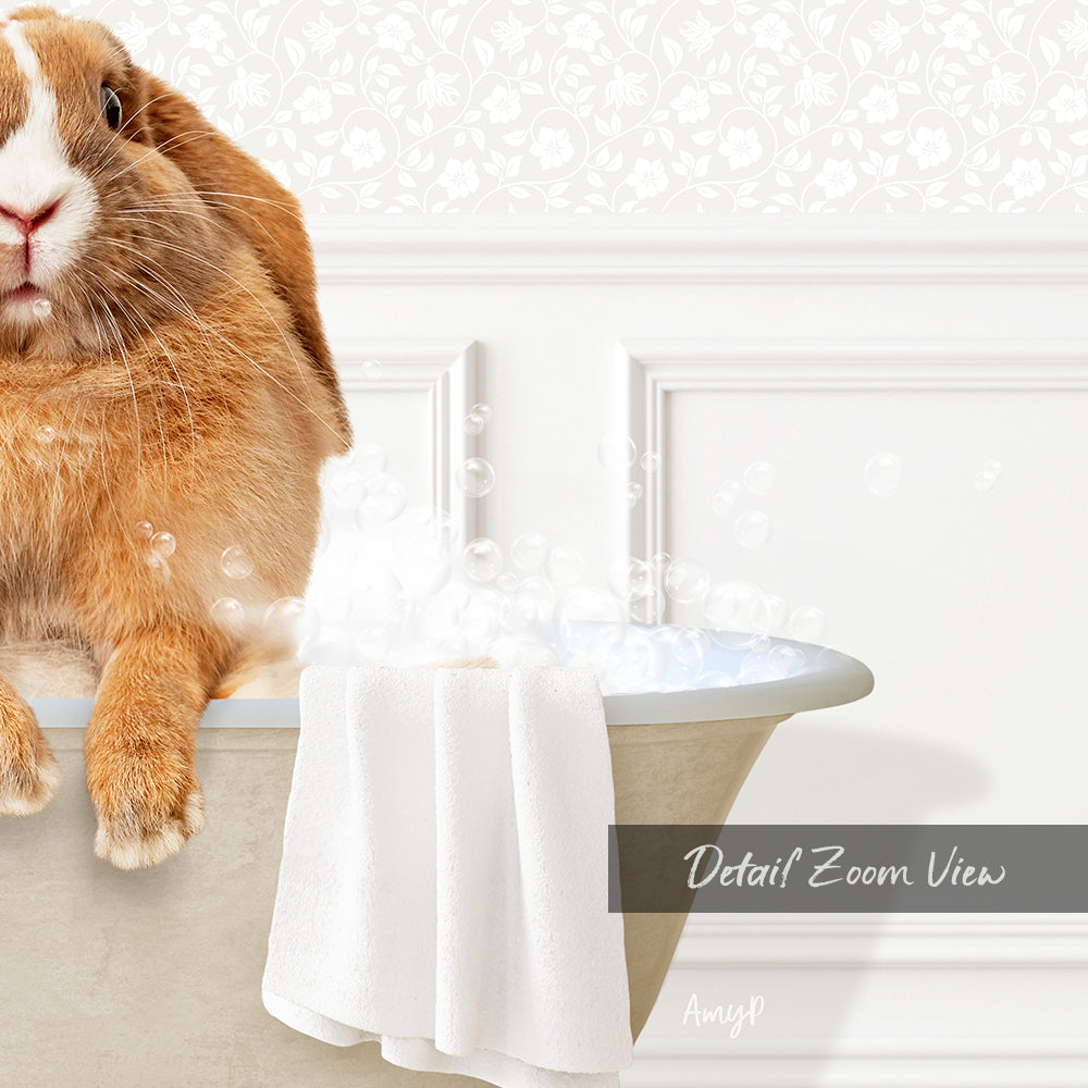 A cute orange rabbit sitting in a bathtub filled with bubbles, with a towel nearby.