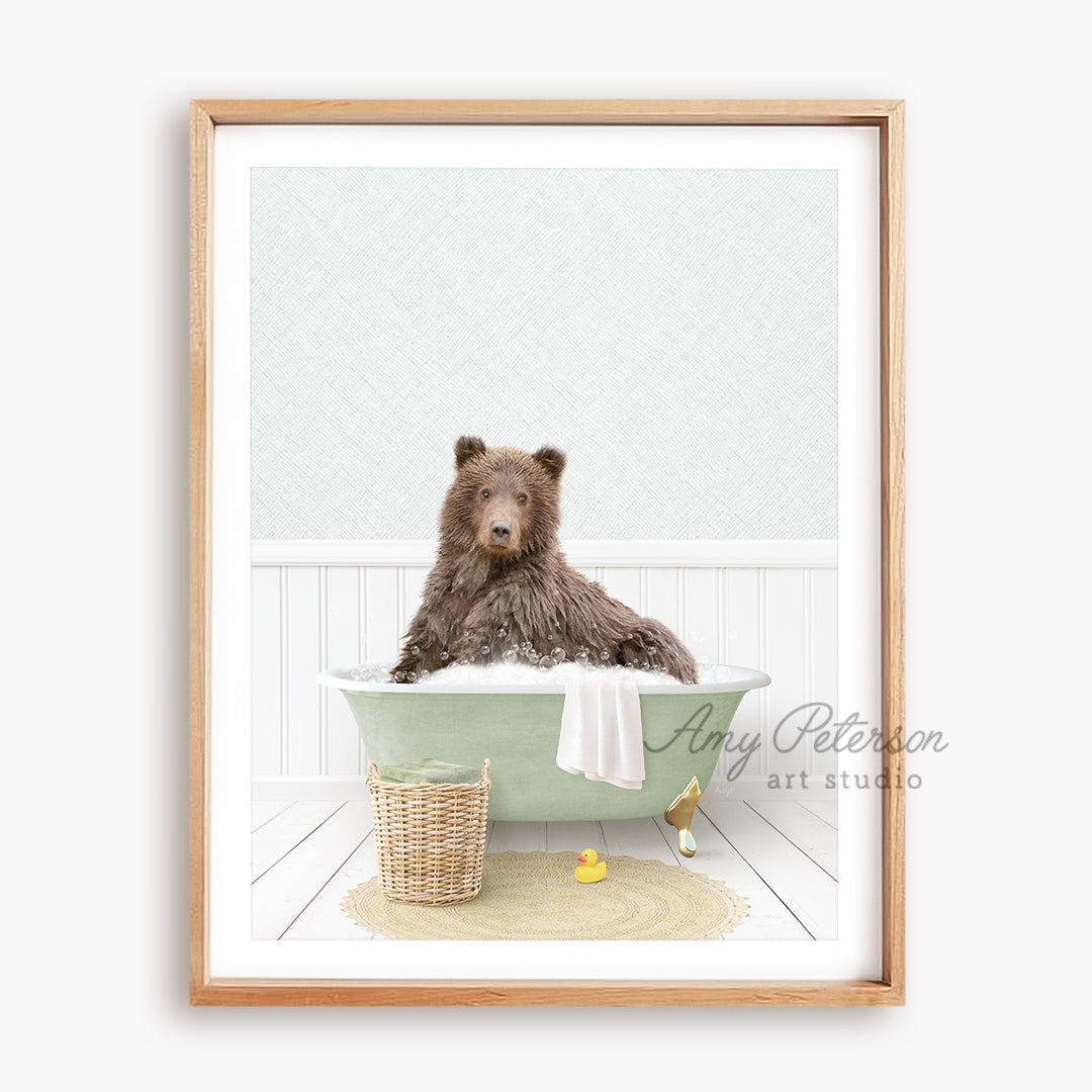 a brown bear sitting in a green bath tub