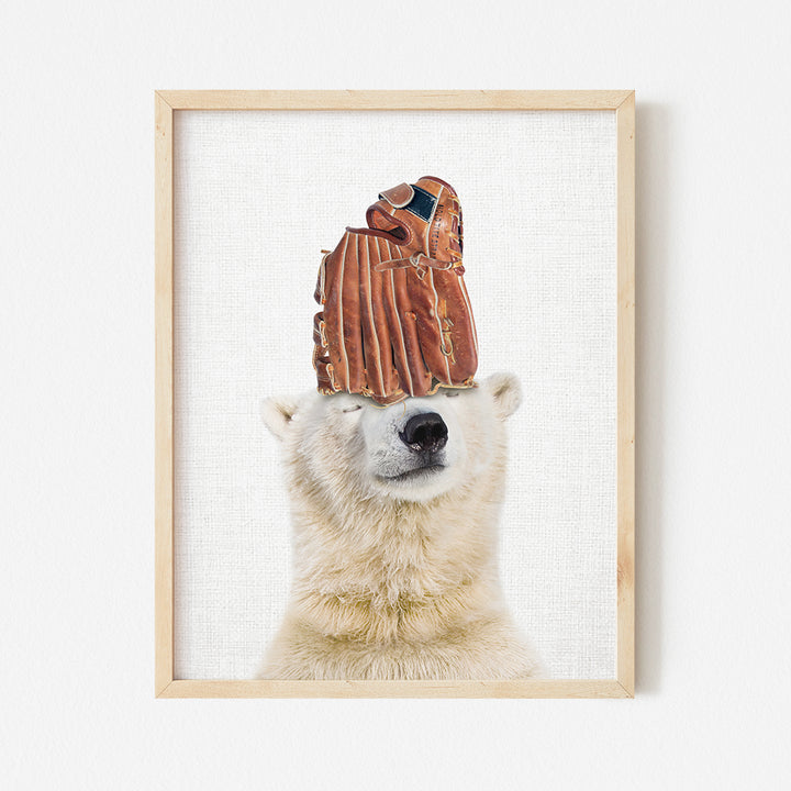 a polar bear with a baseball glove on its head