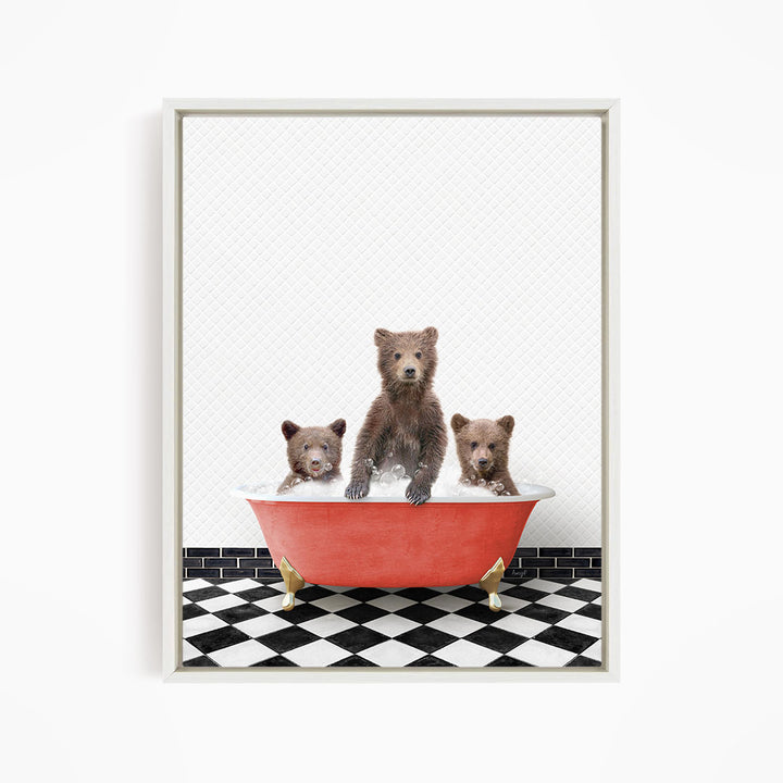 A framed image depicting three brown bears sitting in a red bathtub on a black and white checkered floor.