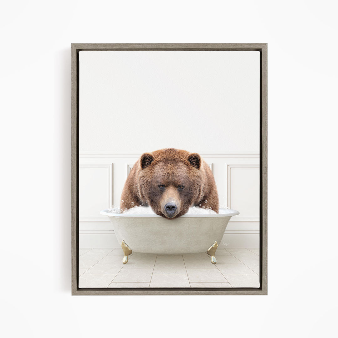 A brown bear is sitting in a white bathtub, appearing to be enjoying a relaxing bath.