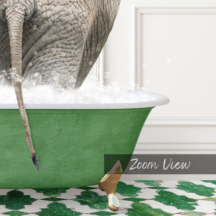 A large elephant is standing in a green bathtub filled with bubbles, with its tail hanging over the side of the tub.