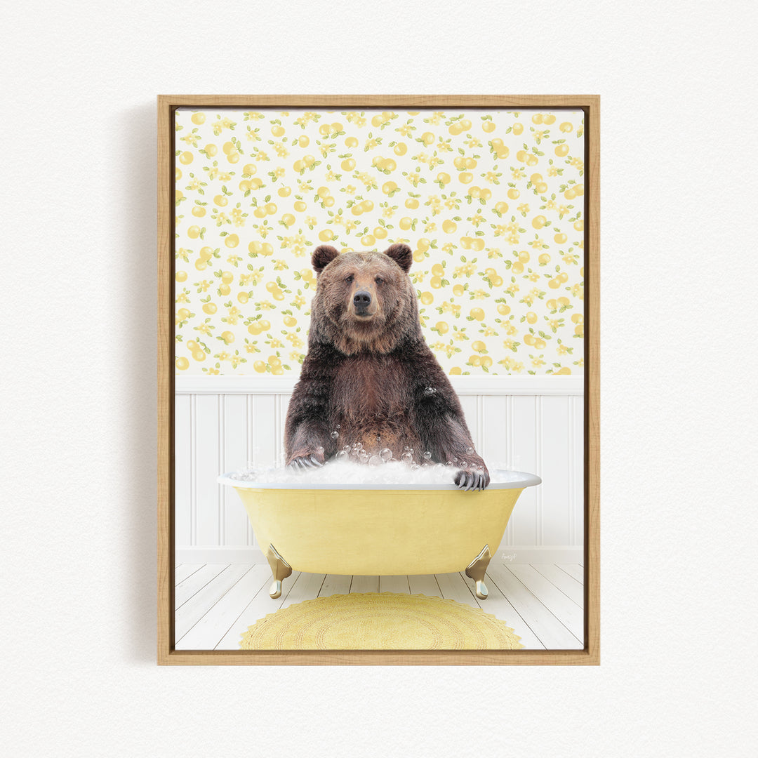A brown bear sitting in a yellow bathtub filled with water, surrounded by a yellow floral pattern on the wall behind it.