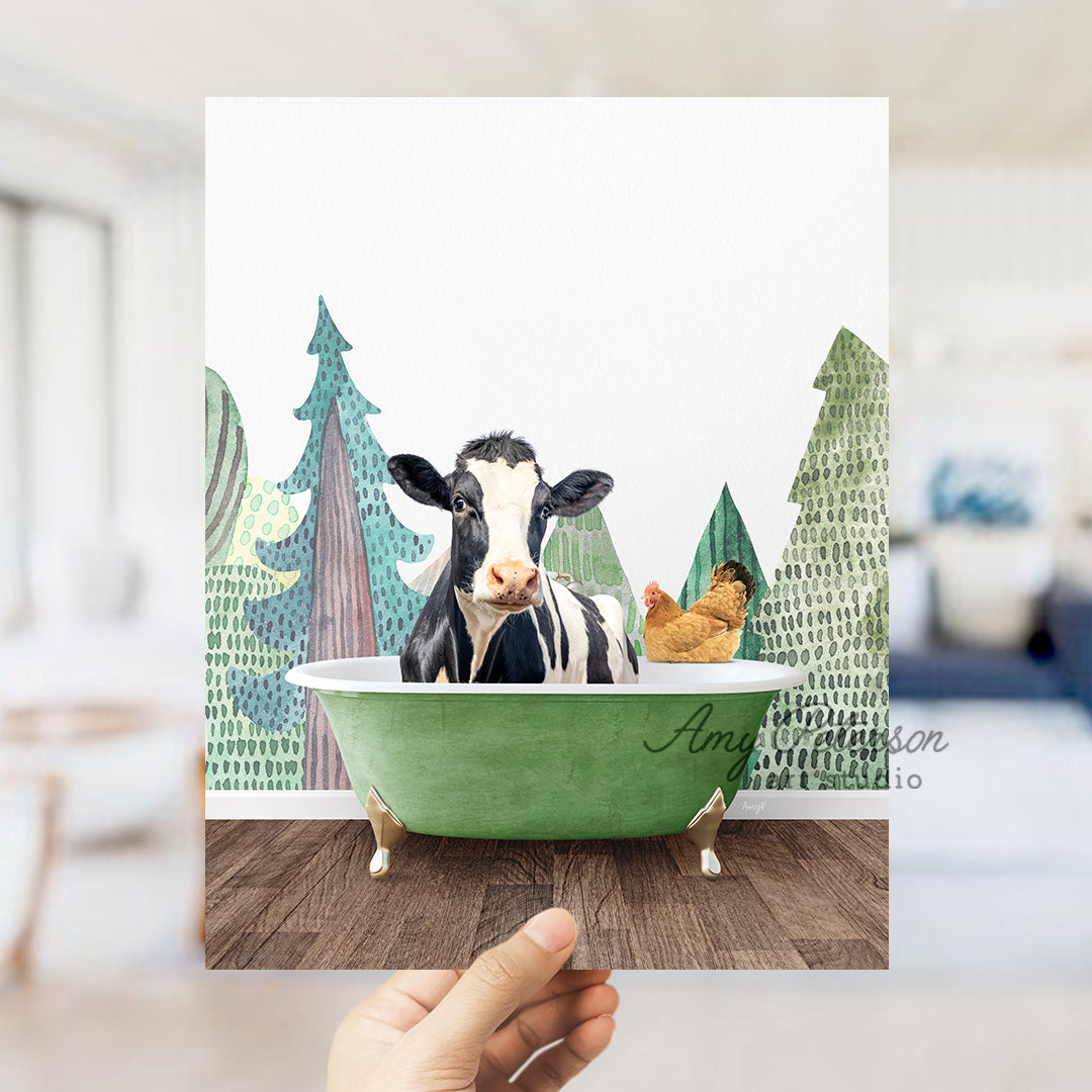 a hand holding up a card with a picture of a cow in a bathtub