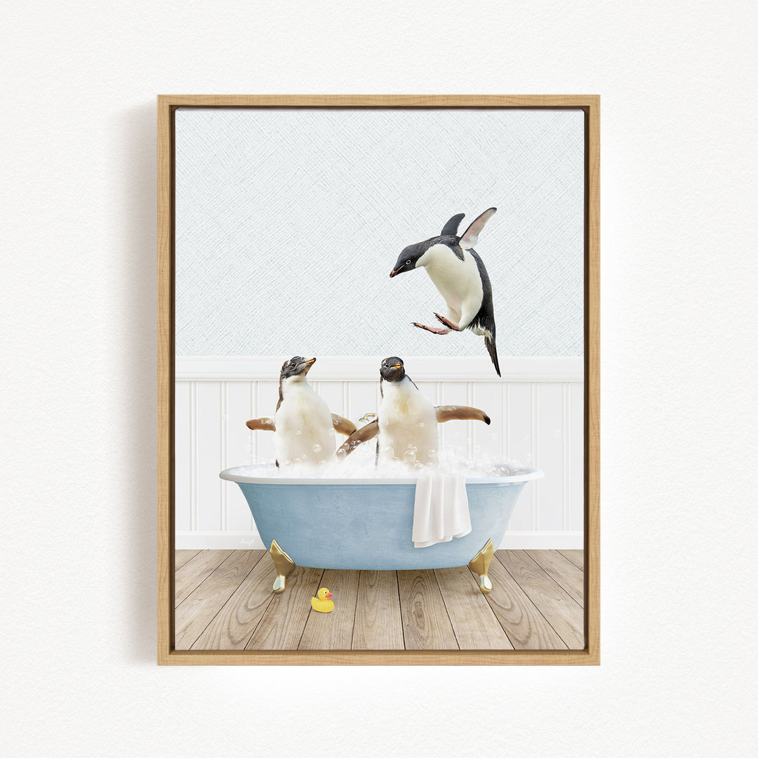 A framed image depicting two penguins sitting in a bathtub, with one penguin flying towards the other.