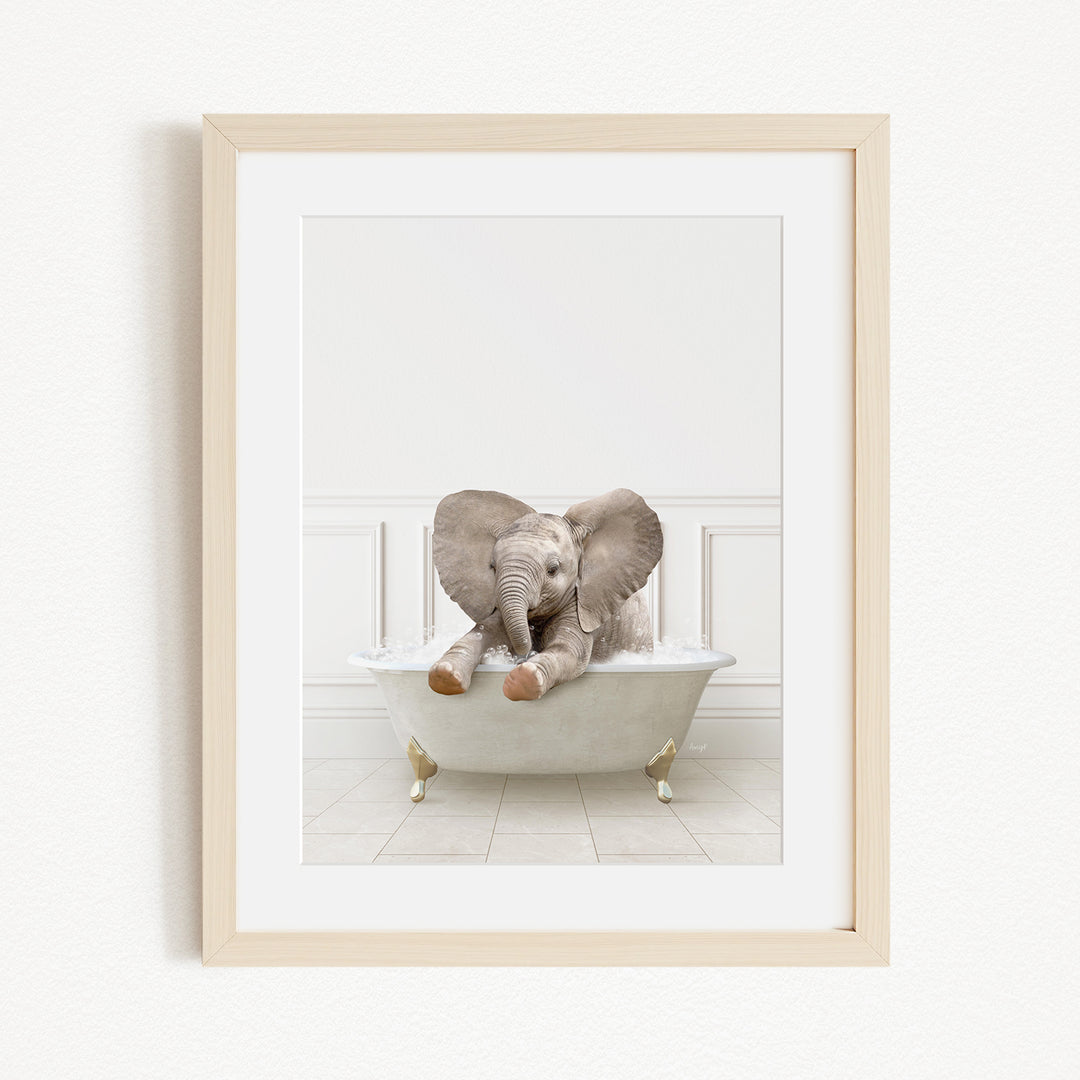 A baby elephant sitting in a white bathtub, with its trunk raised and ears spread out, creating a playful and whimsical scene.