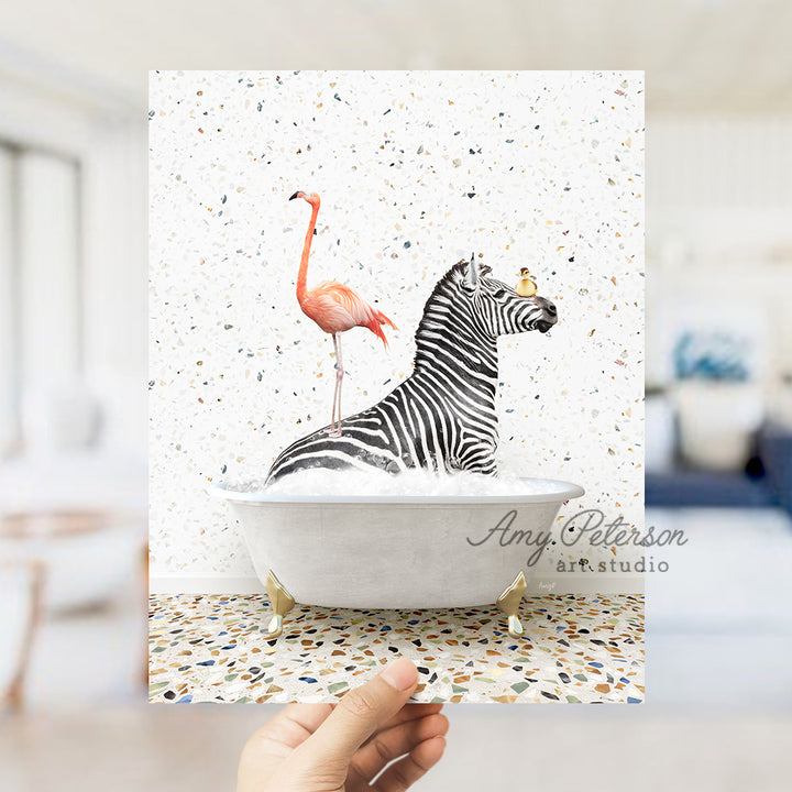 a hand holding up a card with a picture of a zebra and a flamingo