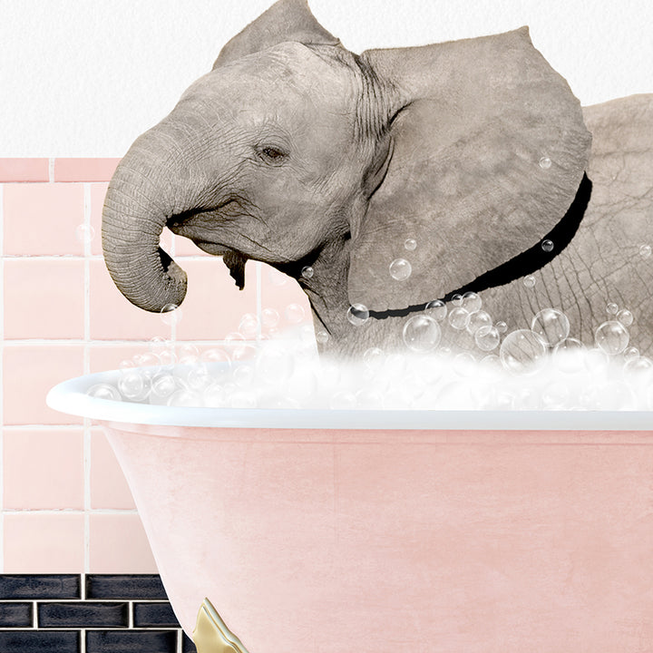 a baby elephant taking a bath in a pink bathtub