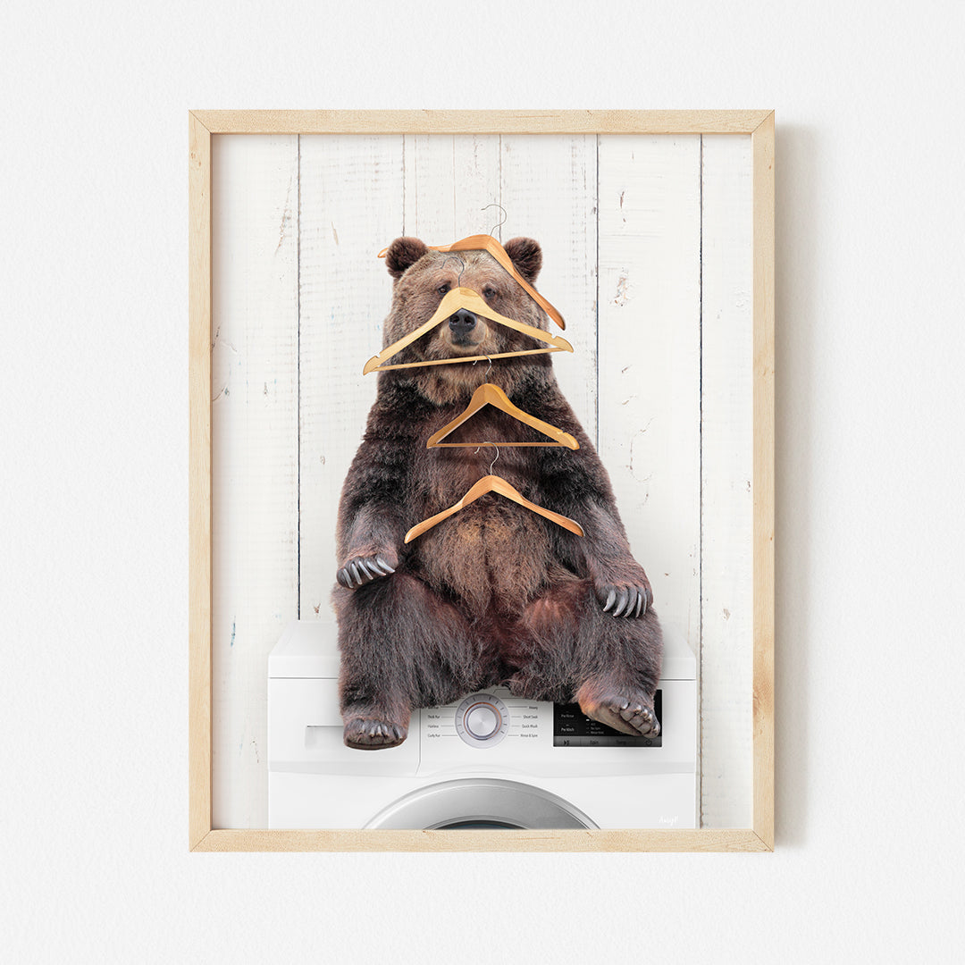 a picture of a bear with clothes tied to it