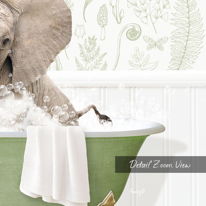 A large elephant is taking a bath in a green bathtub, surrounded by bubbles and a towel.